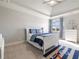 Nautical-themed bedroom with large window and white furniture at 6955 Laurel Oak Dr, Suwanee, GA 30024