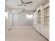 Neutral bonus room features built-in shelving and an attic door at 6955 Laurel Oak Dr, Suwanee, GA 30024