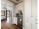 Hallway with built in bar and wine fridge adjacent to main bedroom at 6955 Laurel Oak Dr, Suwanee, GA 30024