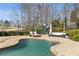 Inviting pool area with lounge chairs, outdoor seating, and a play area at 6955 Laurel Oak Dr, Suwanee, GA 30024