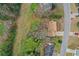 Aerial view of the home showcasing the roof and landscaped yard with mature trees at 1429 Christiana Dr, Lawrenceville, GA 30043