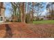 Spacious backyard features mature trees and green grass at 1429 Christiana Dr, Lawrenceville, GA 30043