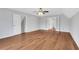 Spacious bedroom with hardwood floors, ceiling fan, and double doors at 1429 Christiana Dr, Lawrenceville, GA 30043