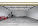 Spacious two car garage with white walls and doors providing ample space for vehicles and storage at 1429 Christiana Dr, Lawrenceville, GA 30043