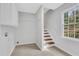 Hallway features stairs, natural light, and is freshly painted at 1429 Christiana Dr, Lawrenceville, GA 30043