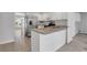Modern kitchen features white cabinets, stainless steel appliances, and granite countertops at 1429 Christiana Dr, Lawrenceville, GA 30043
