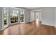 Bright living room featuring hardwood floors, bay window and freshly painted neutral walls at 1429 Christiana Dr, Lawrenceville, GA 30043
