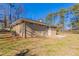 View of the backyard showcasing the home's exterior and a spacious yard at 3517 Hyland Dr, Decatur, GA 30032