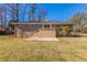 The backyard features a brick patio, stairs, and a well maintained lawn at 3517 Hyland Dr, Decatur, GA 30032