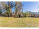 Large backyard with mature trees, offering privacy and space for outdoor activities at 3517 Hyland Dr, Decatur, GA 30032