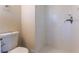 Clean white tile shower and toilet are showcased in the bathroom at 3517 Hyland Dr, Decatur, GA 30032