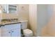 Bright bathroom with granite countertop vanity and white tiled shower at 3517 Hyland Dr, Decatur, GA 30032
