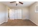 Neutral bedroom featuring a ceiling fan, closet, carpeted floors and natural light from the window at 3517 Hyland Dr, Decatur, GA 30032