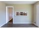 Dining area showcases a pass-through window to the kitchen and hardwood floors, for easy conversation at 3517 Hyland Dr, Decatur, GA 30032