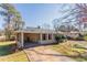Cozy single-Gathering home with a covered front porch, a well-kept lawn, and ample parking space at 3517 Hyland Dr, Decatur, GA 30032