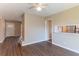 Inviting living room featuring hardwood floors, neutral walls, and a view to the kitchen, great for entertaining at 3517 Hyland Dr, Decatur, GA 30032