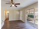 Stylish living room with dark hardwood floors, bright light, and a neutral color scheme throughout the room at 3517 Hyland Dr, Decatur, GA 30032