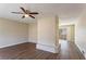 Open-concept living space features hardwood floors, neutral paint, and view of a patio with sliding glass doors at 3517 Hyland Dr, Decatur, GA 30032
