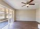 Bright living room boasts hardwood floors, large windows, and modern ceiling fan, creating inviting space at 3517 Hyland Dr, Decatur, GA 30032
