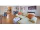 Bright and airy living room with bamboo flooring connecting to a dining area and kitchen at 5678 Kingsport Dr, Sandy Springs, GA 30342