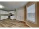 Well-lit kitchen with stainless steel appliances, white cabinets, and hardwood floors at 1148 Fountain Glen Ct, Lawrenceville, GA 30043