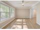 Inviting living room with expansive windows providing natural light and views, complemented by hardwood floors at 2493 Woodacres Ne Rd, Atlanta, GA 30345