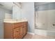 Neutral bathroom features a shower-tub, large mirror and vanity with plenty of storage at 28 Arbor End Se, Smyrna, GA 30080