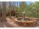 Secluded backyard with a pergola and fountain, perfect for relaxing or entertaining guests at 1270 Seale Dr, Alpharetta, GA 30022