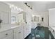 Bright bathroom offers white cabinets, a vanity, and a luxurious feel at 1270 Seale Dr, Alpharetta, GA 30022