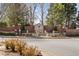 Community entrance featuring a stone Kimball Farms sign, brick walls, and lush landscaping at 1270 Seale Dr, Alpharetta, GA 30022