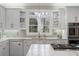 Beautiful kitchen featuring white cabinets, quartz countertops, and a stainless steel oven at 1270 Seale Dr, Alpharetta, GA 30022