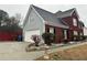 Charming house featuring a brick facade, side garage entry, and newly done landscaping at 3038 Mary Alice Trl, Loganville, GA 30052