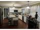 Spacious kitchen featuring white cabinetry, stainless steel appliances, and a breakfast bar at 3038 Mary Alice Trl, Loganville, GA 30052