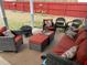 Cozy outdoor patio area with comfortable seating and decorative pillows at 3038 Mary Alice Trl, Loganville, GA 30052