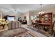 A living room with a dining set, multiple sofas, and a china cabinet at 777 Glen Valley Way, Dacula, GA 30019