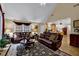 Comfortable living room with plush sofas, a decorative rug, and views into the adjacent dining and kitchen areas at 777 Glen Valley Way, Dacula, GA 30019