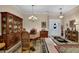 Living room and dining room combination with chandelier and china cabinet at 777 Glen Valley Way, Dacula, GA 30019