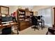 This home office features a built-in desk and plenty of storage space with natural light from the window at 777 Glen Valley Way, Dacula, GA 30019