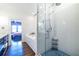 Bathroom showcasing a glass shower, subway tile surround, soaking tub, and wood floors leading to the bedroom at 902 E Ponce De Leon Ave, Decatur, GA 30030