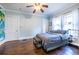 Bedroom with wood floors, a ceiling fan, and windows dressed with white curtains at 902 E Ponce De Leon Ave, Decatur, GA 30030