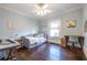 Light-filled bedroom with hardwood floors, daybed, desk area, and a ceiling fan at 902 E Ponce De Leon Ave, Decatur, GA 30030