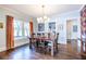 Elegant dining room with hardwood floors, large windows, and a modern chandelier at 902 E Ponce De Leon Ave, Decatur, GA 30030