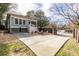 Large backyard with gravel fire pit, driveway, and fenced in yard at 902 E Ponce De Leon Ave, Decatur, GA 30030