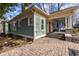 Charming home featuring a covered porch, brick walkway, and verdant landscaping at 902 E Ponce De Leon Ave, Decatur, GA 30030