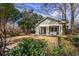 Charming home featuring a covered porch and meticulously manicured lawn at 902 E Ponce De Leon Ave, Decatur, GA 30030