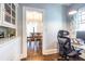 Hallway with hardwood floors, built in cabinet, and view to dining room at 902 E Ponce De Leon Ave, Decatur, GA 30030