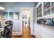 Hallway with hardwood floors, built in cabinet, and view to dining room at 902 E Ponce De Leon Ave, Decatur, GA 30030