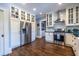 Charming kitchen featuring stainless steel appliances, granite countertops, and ample white cabinetry at 902 E Ponce De Leon Ave, Decatur, GA 30030