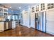 Open kitchen with stainless steel appliances, white cabinets, and hardwood floors at 902 E Ponce De Leon Ave, Decatur, GA 30030