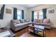 Bright living room featuring two sofas, hardwood floors, and a modern coffee table at 902 E Ponce De Leon Ave, Decatur, GA 30030